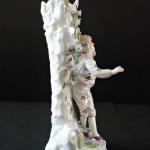 Figural stand with young men Figural stand with young men