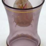 Glass with gold medallion and duck Glass with gold medallion and duck