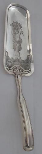 Silver shovel with figural motif Silver shovel with figural motif