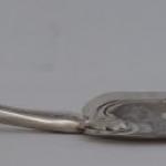 Silver shovel with figural motif Silver shovel with figural motif