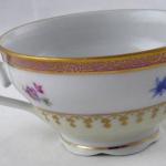 Coffee cup with pink top line and gilded ornament Coffee cup with pink top line and gilded ornament