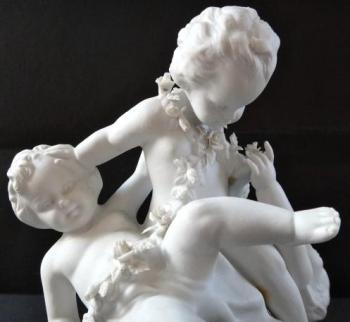 Sculpture of three children with a garland of flow Sculpture of three children with a garland of flow