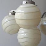 Chandelier made of white metal, with shaped balls Chandelier made of white metal, with shaped balls