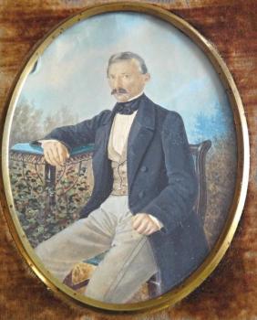 Miniature man sitting in the garden Miniature man sitting in the garden