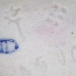 Boy tuning a violin - Passau, Germany Boy tuning a violin - Passau, Germany