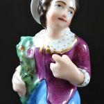 Figural pair of boy and girl on a pedestal Figural pair of boy and girl on a pedestal