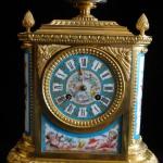 Bronze clock with miniatures