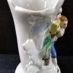 Vase with a figure of a girl and a basket