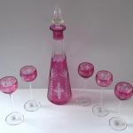 Carafe and five tall glasses, clear and pink glass