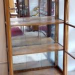 Walnut showcase, with arch and etched glass