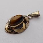 Silver and gilded pendant with a tigers eye