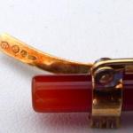 Gold brooch with carnelian and diamonds