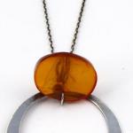 Silver necklace, circle, and oval amber