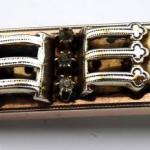 Gilded silver brooch with three rhinestones 