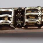 Gilded silver brooch with three rhinestones 