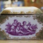 Brass mounted porcelain box painted with gallant scenes, with gilded decor, Prussia 1850