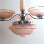 White metal chandelier with pink shades