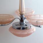 White metal chandelier with pink shades