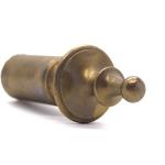 The brass finial cap of the curtain rod