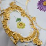 Meissen plate with golden cartouches and painted f