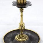 Candlestick made of polished brass and cast iron