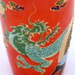 Small red vase with figures and dragon