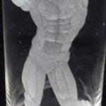 Tall glass with engraving of a bodybuilder