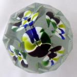 Glass paperweight with striped funnel-shaped flowe