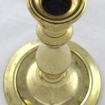 Brass candlestick in the shape of a column