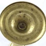 Brass candlestick in the shape of a column