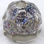 Glass paperweight with facets and colourful flower