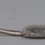 Silver shovel with figural motif