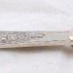 Decorative serving knife with silver handle