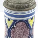 Faience tankard with cartouches and silver coin 