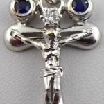 White gold cross with diamond and paired blue sapp