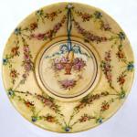 Footed bowl with painted festoons and basket