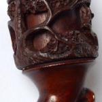 Pipe with carved deer and rope motif