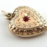 Gilded silver heart with red rhinestone