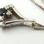 Gold necklace with diamonds and blue sapphire