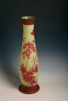 Yellow vase with red flowers