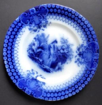 Blue stoneware plate with a peacock -Sarreguemines