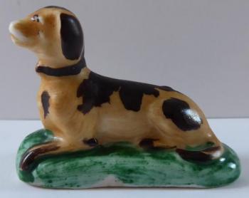 Porcelain miniature statuette of a dog