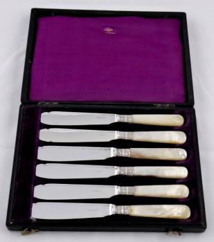 Six silver-plated knives, with mother-of-pearl 