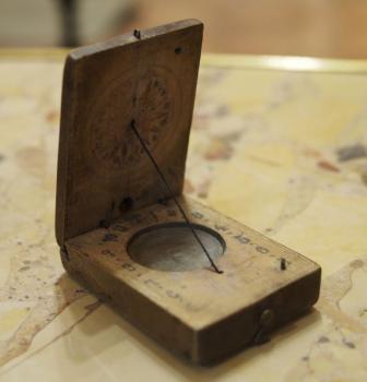 Pocket sundial with compass