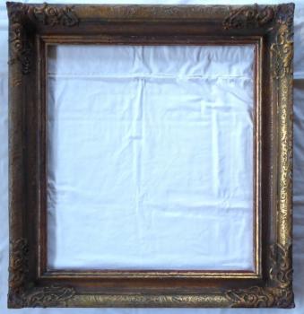 Patinated gold frame with decorations, square shap