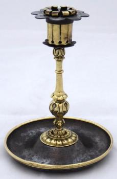 Candlestick made of polished brass and cast iron