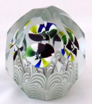 Glass paperweight with striped funnel-shaped flowe