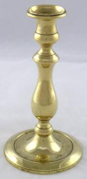 Brass candlestick in the shape of a column