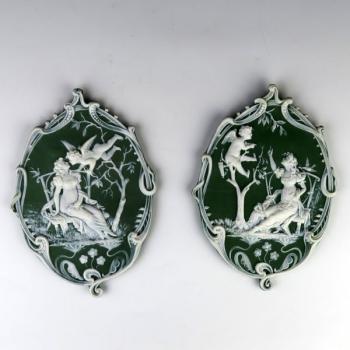 A pair of decorative plaques