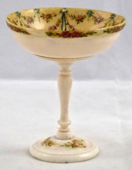 Footed bowl with painted festoons and basket